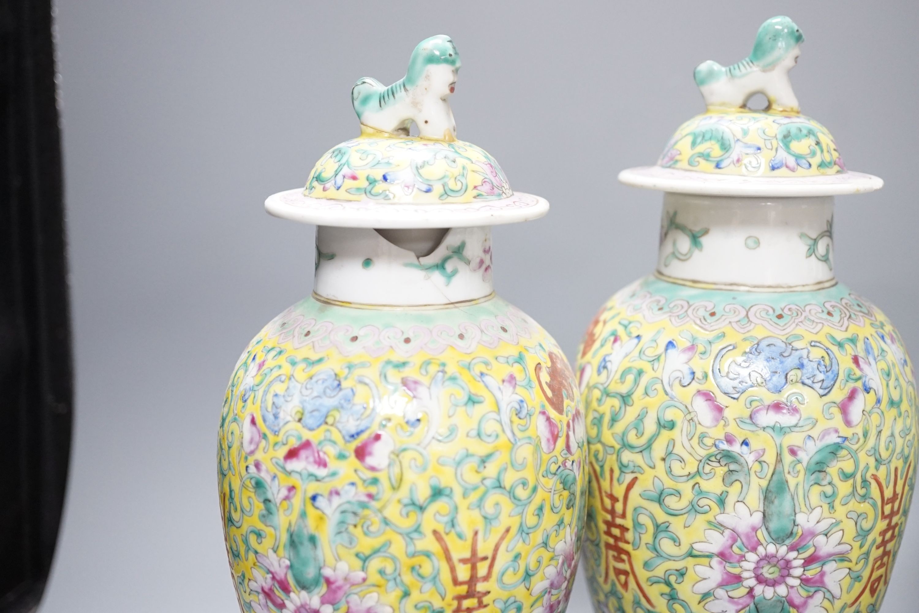 A pair of Chinese porcelain vases and covers, a pair of jars and covers, a metal mounted vase and cover and two prunus jars, (7), Tallest vases 26.5 cms high including cover.